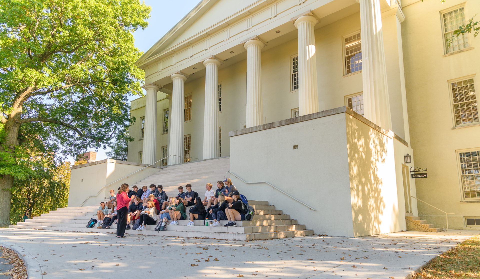 students in front of a building