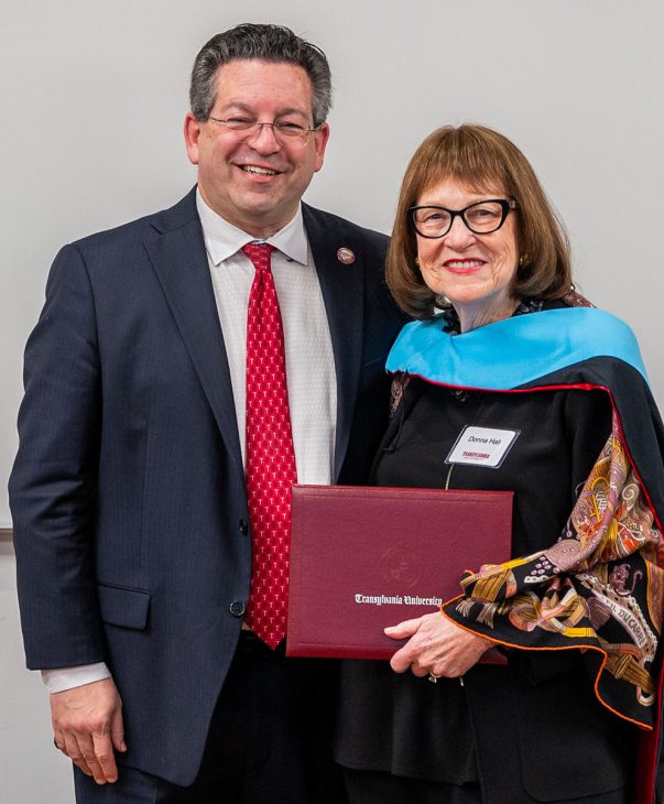 two people posing, with with an honorary degree