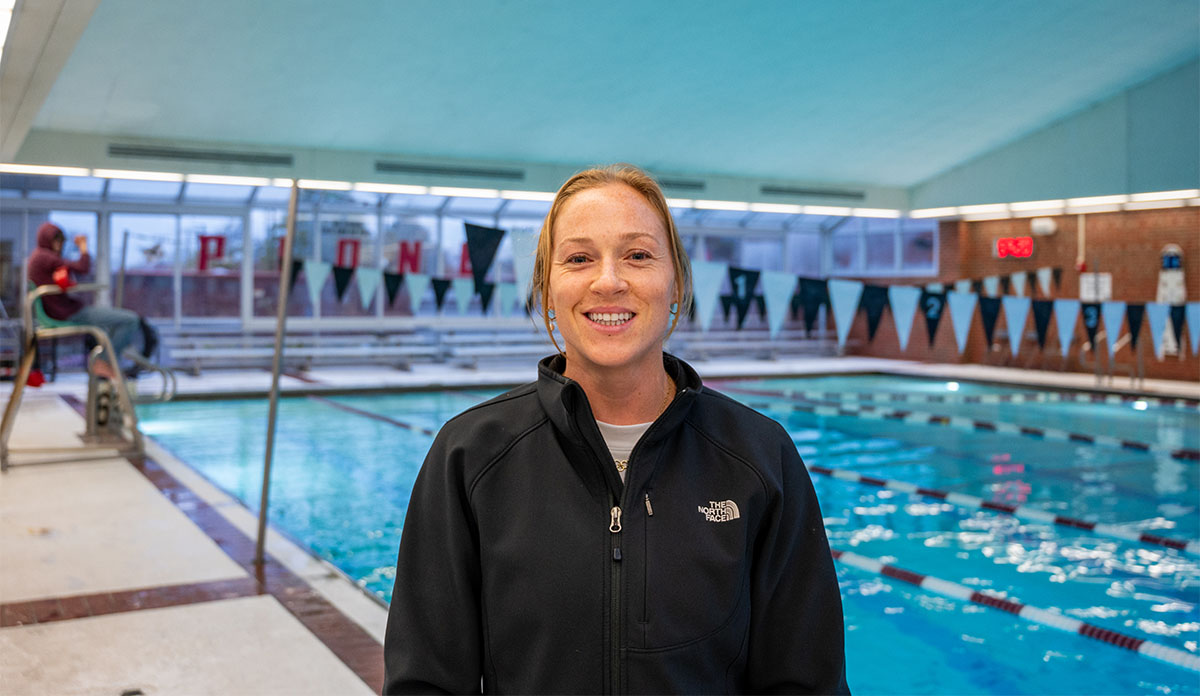 person posing next to a pool