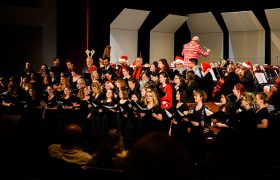 performers on stage for a holiday concert