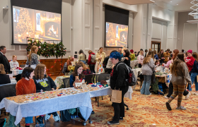 people shopping at a holiday market