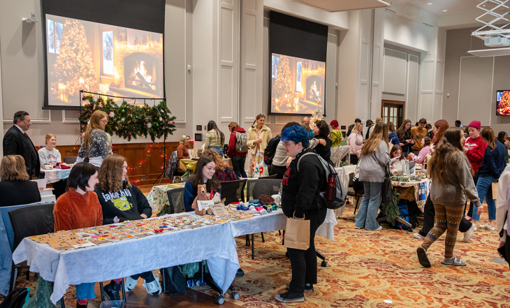 people shopping at a holiday market