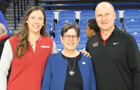 three people posing for a photo