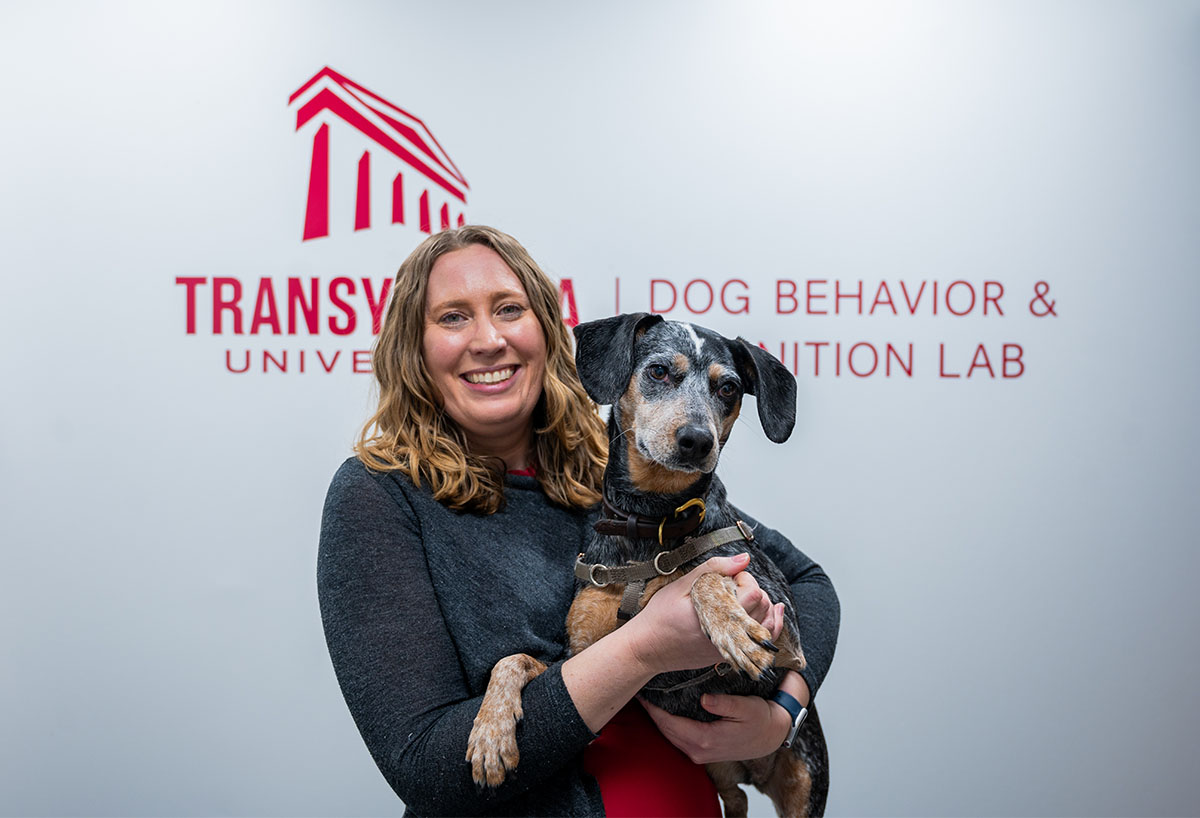 woman holding a dog