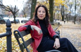 a woman sitting on a bench