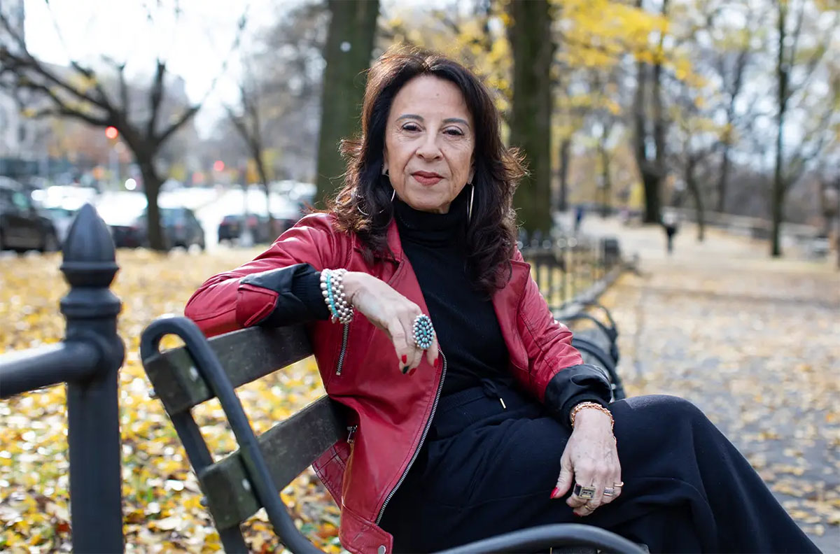 a woman sitting on a bench