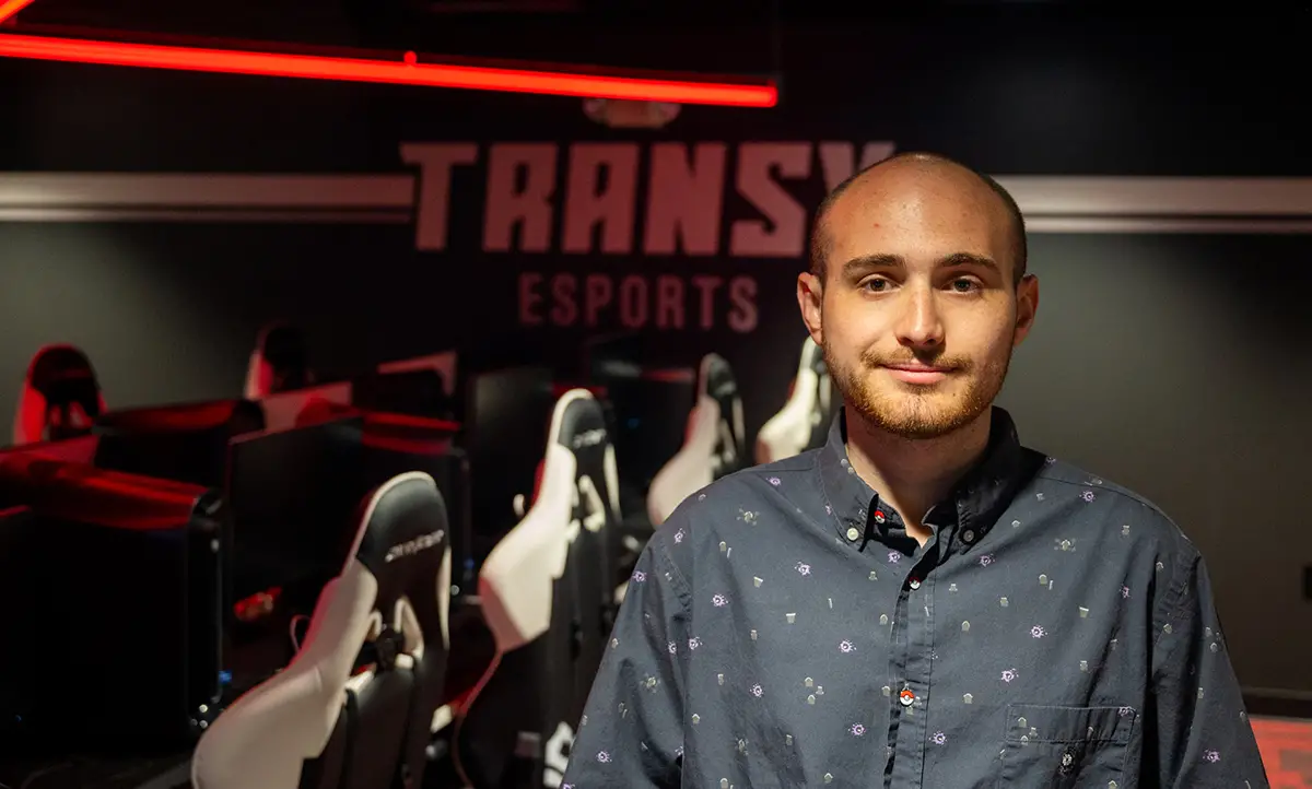 person posing in an esports arena