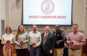 people holding awards