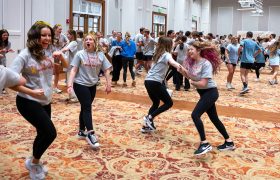 students dancing in a large room