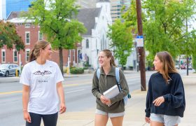 students walking along a city street