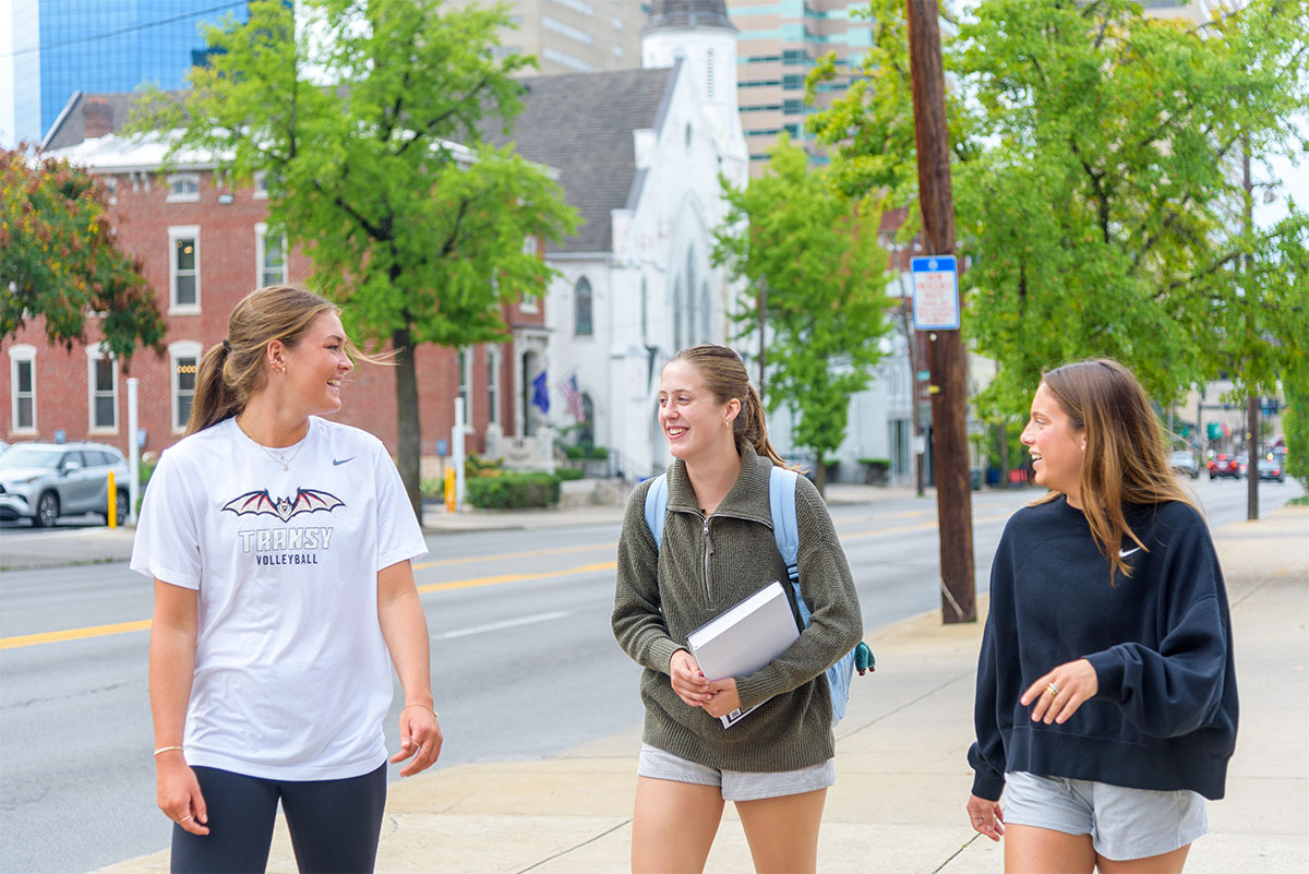 students walking along a city street