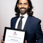 Portrait of Amit B. Patel holding award