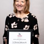 portrait of Liz Phearson Fulkerson holding award