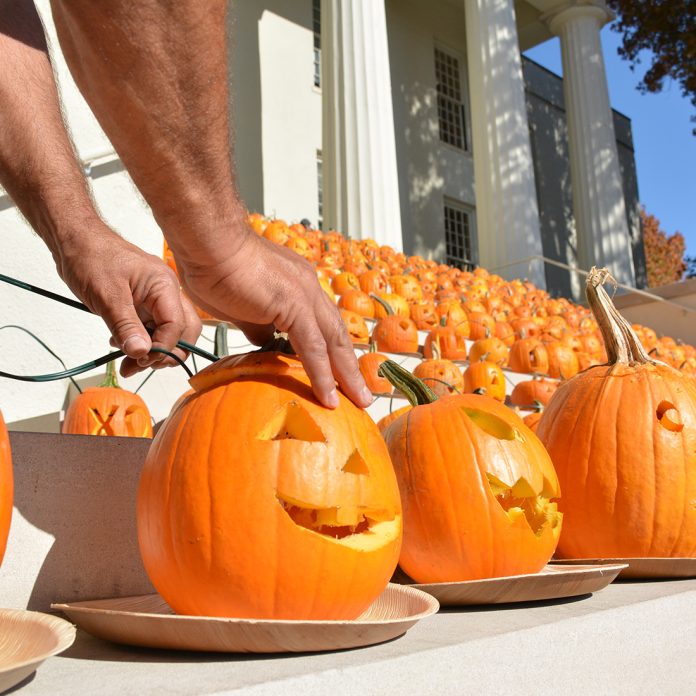 pumpkins being wired with lights