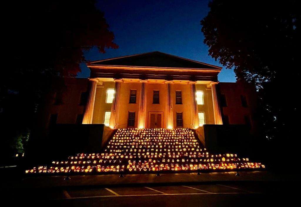 Old Morrison at night with steps decorated with lit pumkins