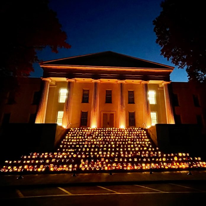 Old Morrison at night with steps decorated with lit pumkins