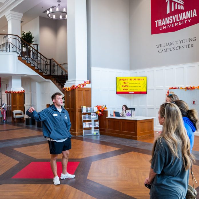 student leading tour inside the campus center