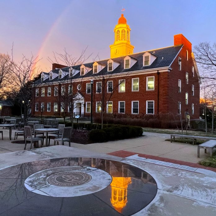 carpenter academic center with a rainbow during winter